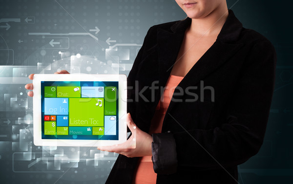 Lady holding tablet with modern software operational system Stock photo © ra2studio