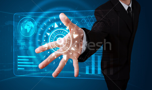 Businessman pressing high tech type of modern buttons Stock photo © ra2studio