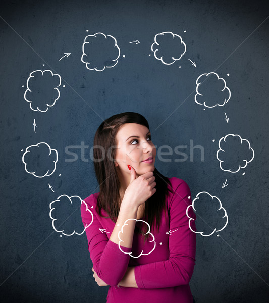 Stock photo: Young woman thinking with cloud circulation around her head