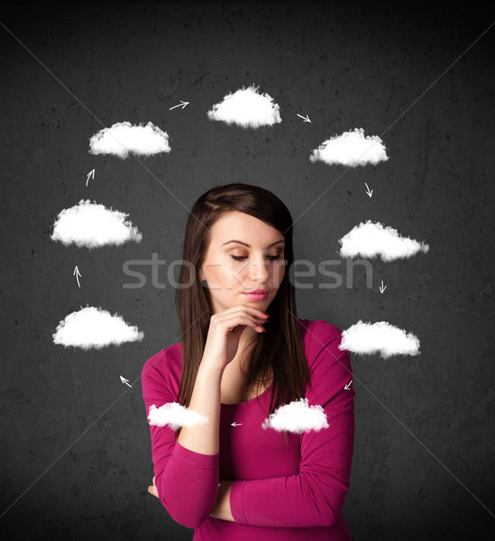 Young woman thinking with cloud circulation around her head Stock photo © ra2studio