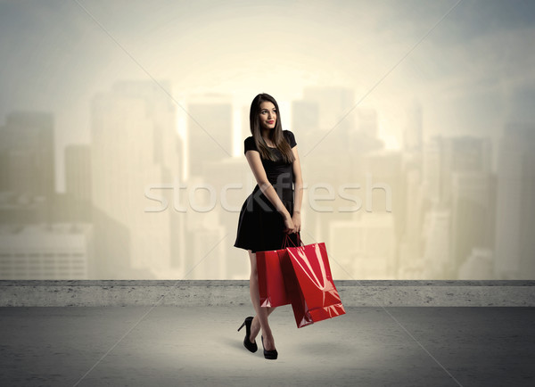 City woman standing with shopping bags Stock photo © ra2studio