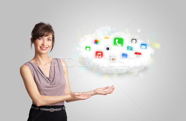 Young woman presenting cloud with colorful app icons and symbols Stock photo © ra2studio