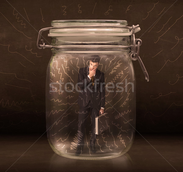 Businessman inside a jar with powerful hand drawn lines concept Stock photo © ra2studio