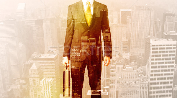 Business man looking at overlay city background Stock photo © ra2studio