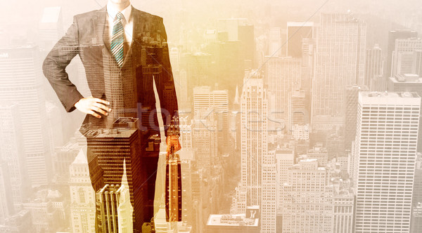 Business man looking at overlay city background Stock photo © ra2studio