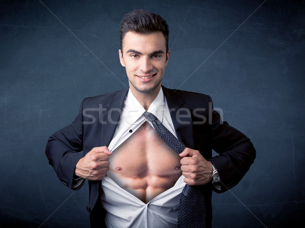 Businessman tearing off shirt and showing mucular body Stock photo © ra2studio