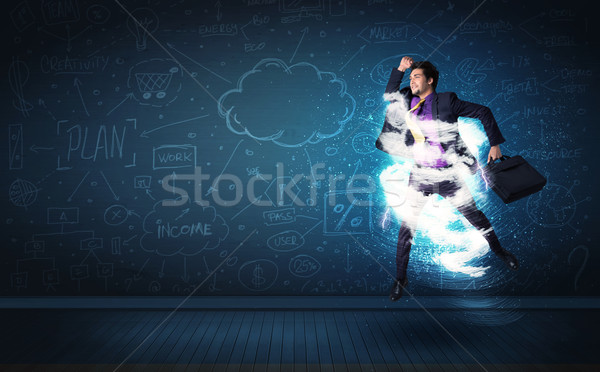 Fericit om de afaceri jumping furtună nor in jurul Imagine de stoc © ra2studio
