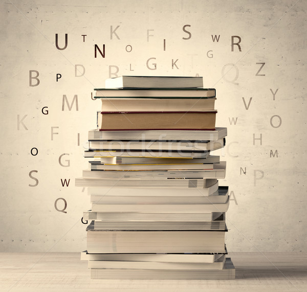 Books with flying letters on vintage background Stock photo © ra2studio