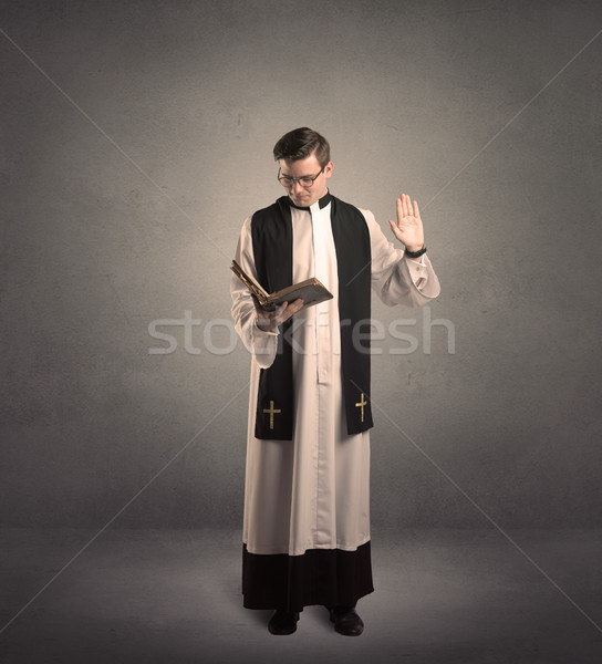 Prêtre bénédiction jeunes main lumière croix [[stock_photo]] © ra2studio
