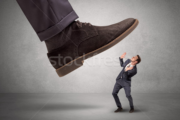 Employee afraid of the big boss foot Stock photo © ra2studio