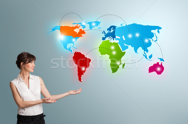 Young woman presenting colorful world map Stock photo © ra2studio
