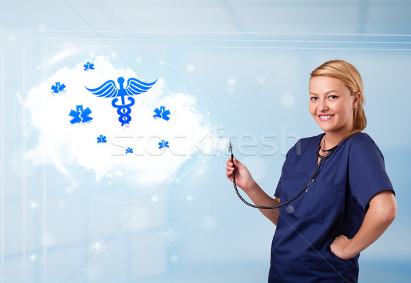 Young doctor with abstract cloud and medical icons Stock photo © ra2studio