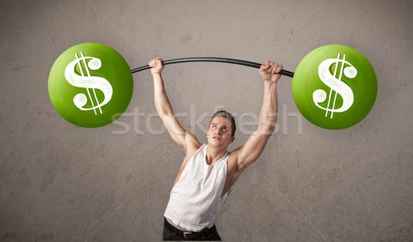 Muskularny człowiek zielone znak dolara wagi Zdjęcia stock © ra2studio