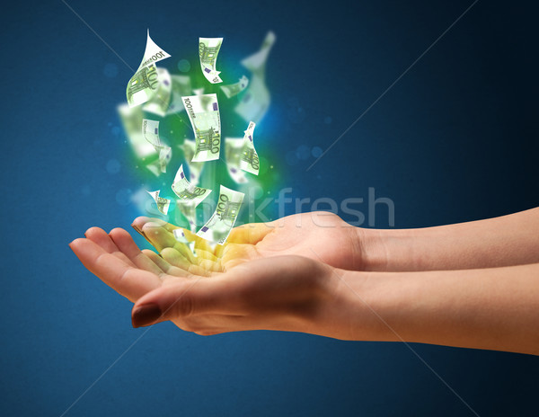 Izzó pénz kéz nő tart papír Stock fotó © ra2studio