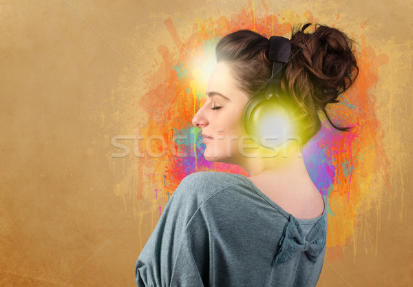 Young woman with headphones listening to music Stock photo © ra2studio