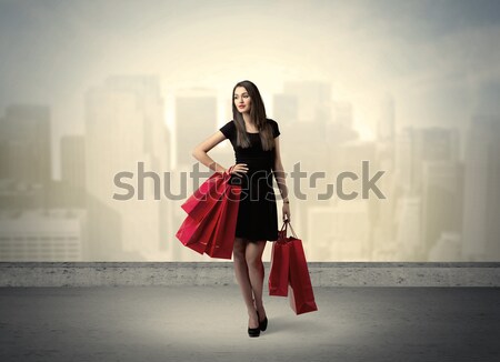 City woman standing with shopping bags Stock photo © ra2studio