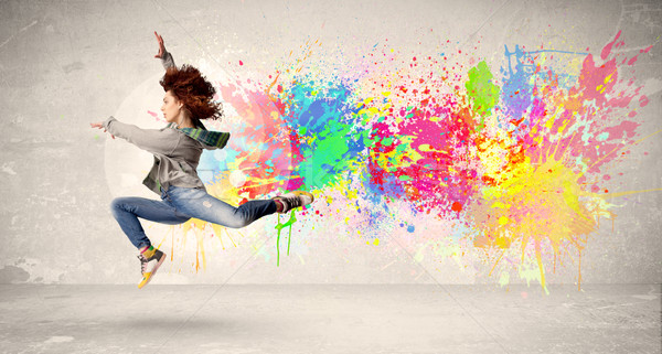 Szczęśliwy nastolatek skoki kolorowy atramentu splatter Zdjęcia stock © ra2studio
