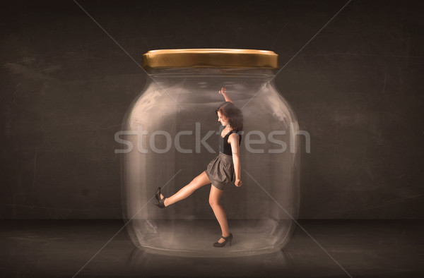 Businesswoman captured in a glass jar concept Stock photo © ra2studio