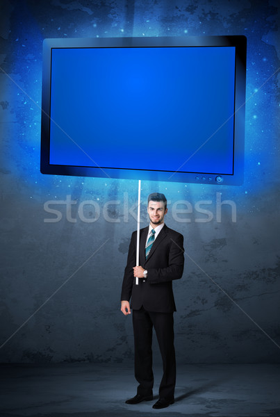 Businessman with shining tablet Stock photo © ra2studio