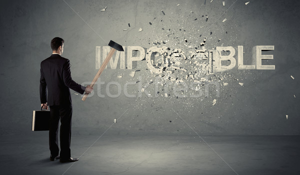 Homem de negócios impossível assinar martelo sujo parede Foto stock © ra2studio