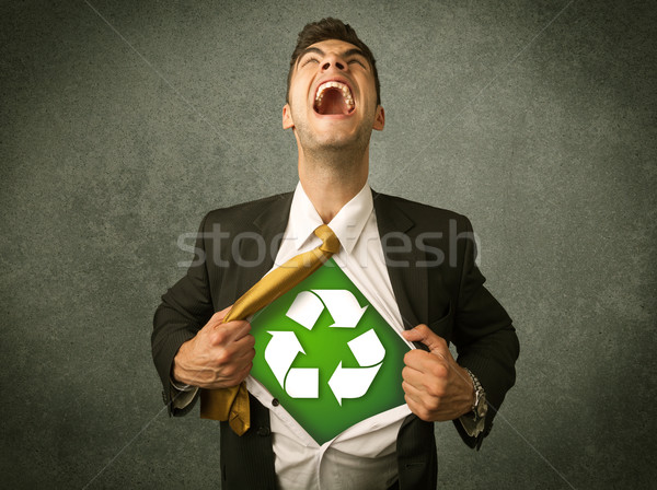 Enviromentalist business man tearing off shirt with recycle sign Stock photo © ra2studio