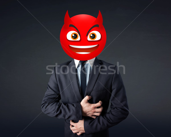 businessman wears devil smiley face Stock photo © ra2studio