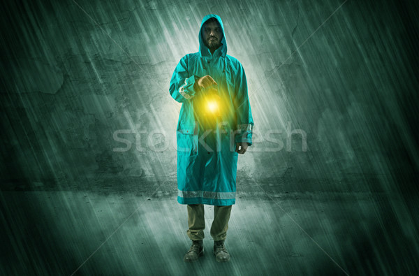 Wayfarer with lantern in front of crumbly wall Stock photo © ra2studio