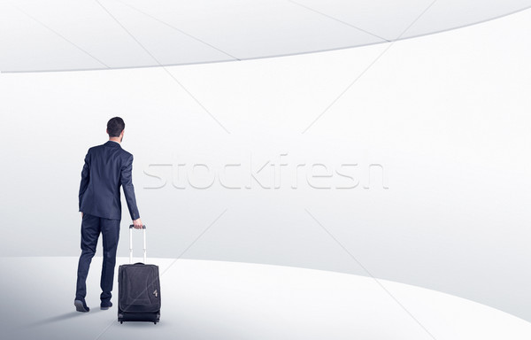 Empresario maleta caminando sala de espera atrás blanco Foto stock © ra2studio