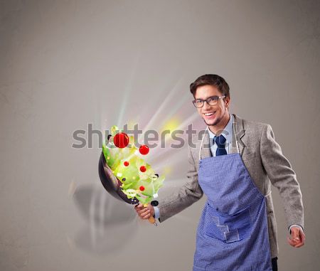 Handsome man with kitchen accessories icons Stock photo © ra2studio