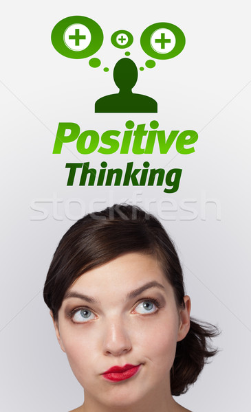 Young girl looking at positive negative signs Stock photo © ra2studio