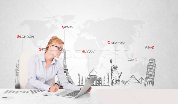 Beautiful young businesswoman with world map and major landmarks of the world Stock photo © ra2studio
