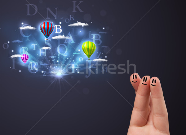 Stock photo: Happy cheerful smiley fingers looking at hot air balloons in the cloudy sky