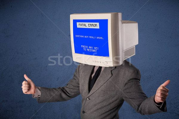 Person with a monitor head and fatal error blue screen on the di Stock photo © ra2studio