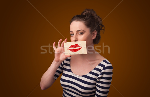 Heureux jolie femme carte baiser rouge à lèvres [[stock_photo]] © ra2studio