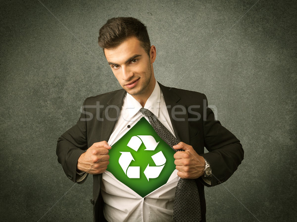 Enviromentalist business man tearing off shirt with recycle sign Stock photo © ra2studio