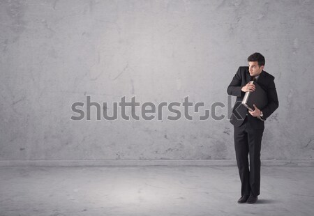 Stock photo: Young businessman standing confused