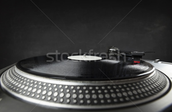 Turntable playing vinyl close up with needle on the record  Stock photo © ra2studio