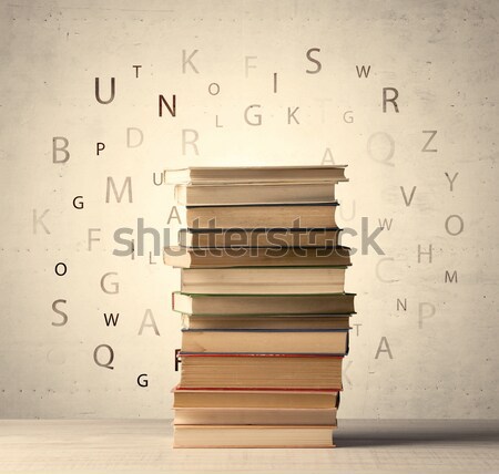 Books with flying letters on vintage background Stock photo © ra2studio