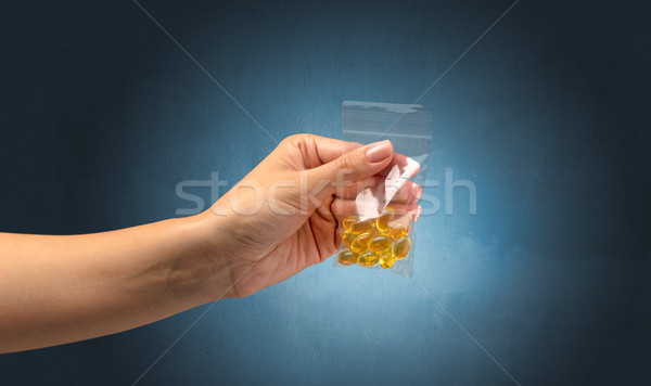 Giving drugs in plastic bag Stock photo © ra2studio