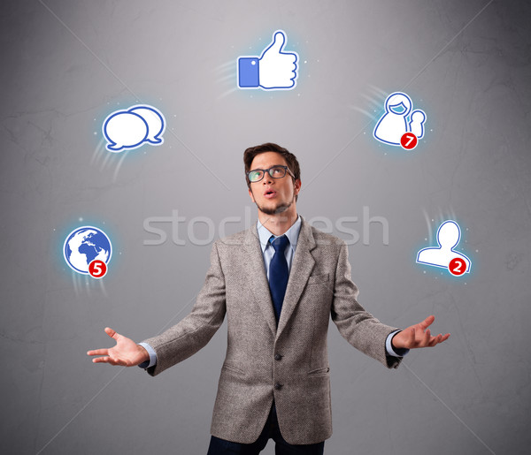 Stock photo: handsome young boy juggling with social media icons