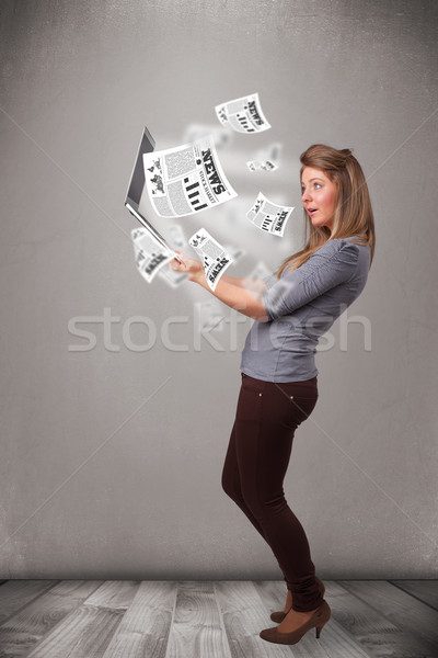 Stock photo: Casual pretty young woman holdin notebook and reading the explosive news