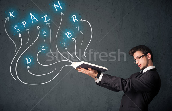 Young man reading a book while multiple choices are coming out of the book Stock photo © ra2studio