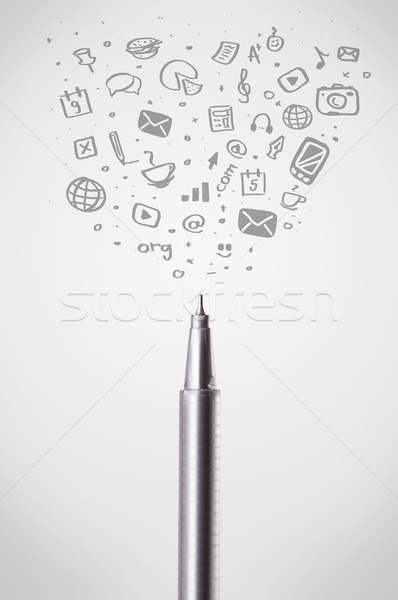 Pen close-up with social media icons Stock photo © ra2studio