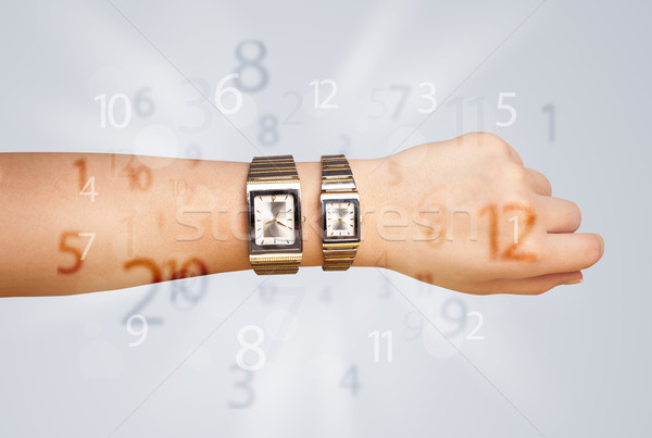 Hand with watch and numbers on the side comming out Stock photo © ra2studio