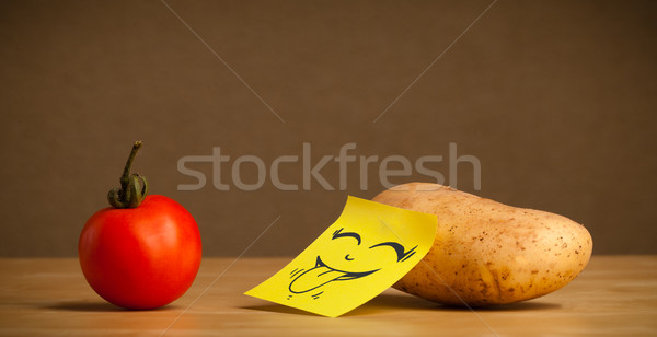 Potato with post-it note sticking out tongue to tomato Stock photo © ra2studio