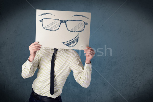 üzletember tart papír mosolygós arc fiatal fej Stock fotó © ra2studio