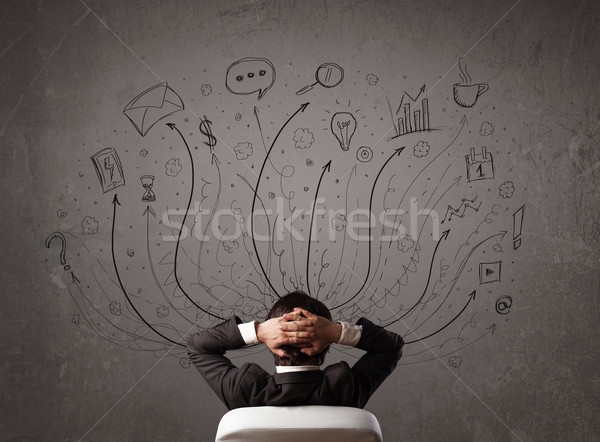 Businessman in front of a chalkboard deciding with arrows and si Stock photo © ra2studio