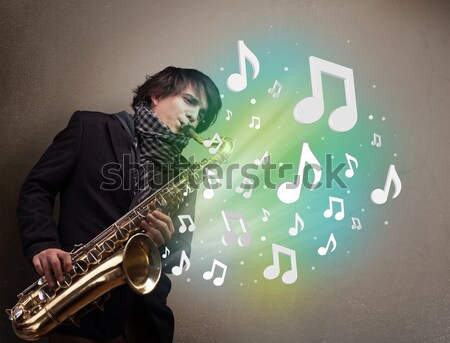 Zdjęcia stock: Młodych · muzyk · gry · saksofon · muzyki · zauważa · atrakcyjny
