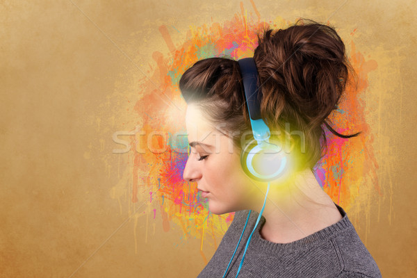 Young woman with headphones listening to music Stock photo © ra2studio