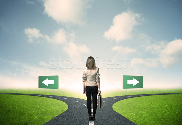 Businesswoman in front of a choice Stock photo © ra2studio